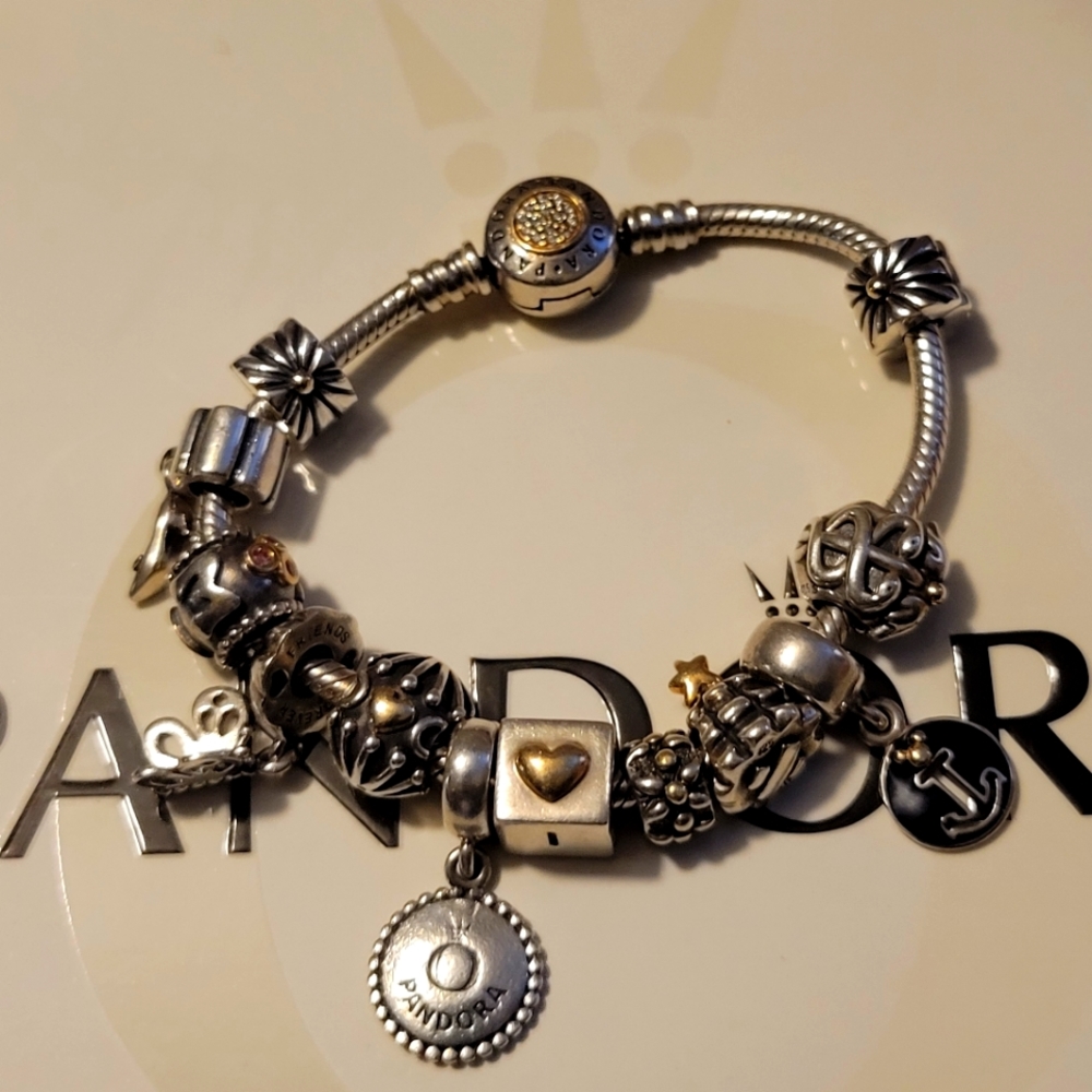 Pandora silver 14k Bracelet with silver 14k Charms.